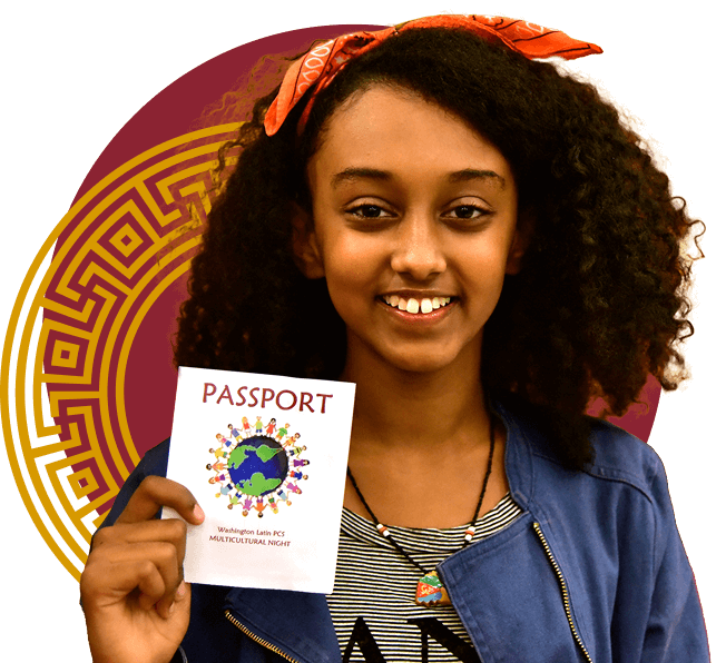 A young girl with curly hair and a red bandana smiles while holding up a "Passport" booklet with a globe on the cover.