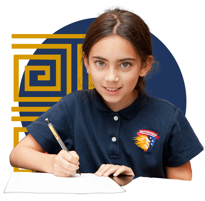 A young girl in a navy polo shirt with an emblem writes on a piece of paper, looking up with a slight smile.
